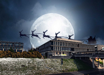 Silhouette of Santa and reindeers flies over the main Library building
