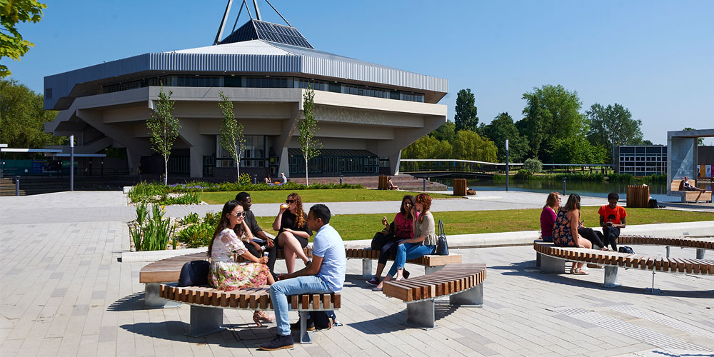 Postgraduate students sitting in Greg's Place