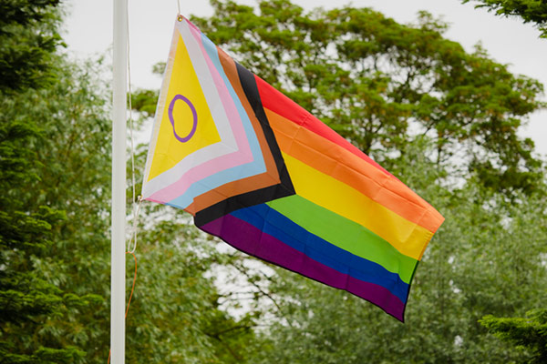 The Pride flag raised on campus