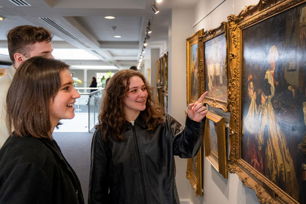 A group of students on a field trip to an art gallery.