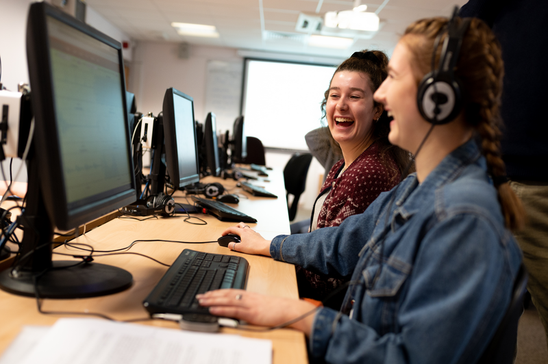 Two students working at a computer