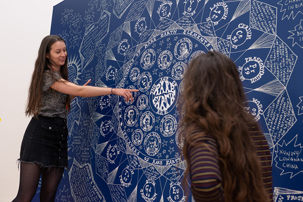 Two students analysing a work of art