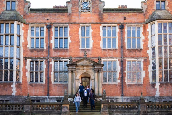A group of Liberal Arts students leaving Heslington Hall, where their study room is based.