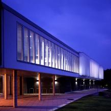 The innovative Music Research Centre building at night, showing the automated solar shading system