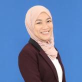 Dr Nuradilla Mohamad Fauzi headshot photograph against a blue background