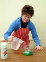 Picture of step 2, adding water slowly to salt and washing-up liquid mixture.